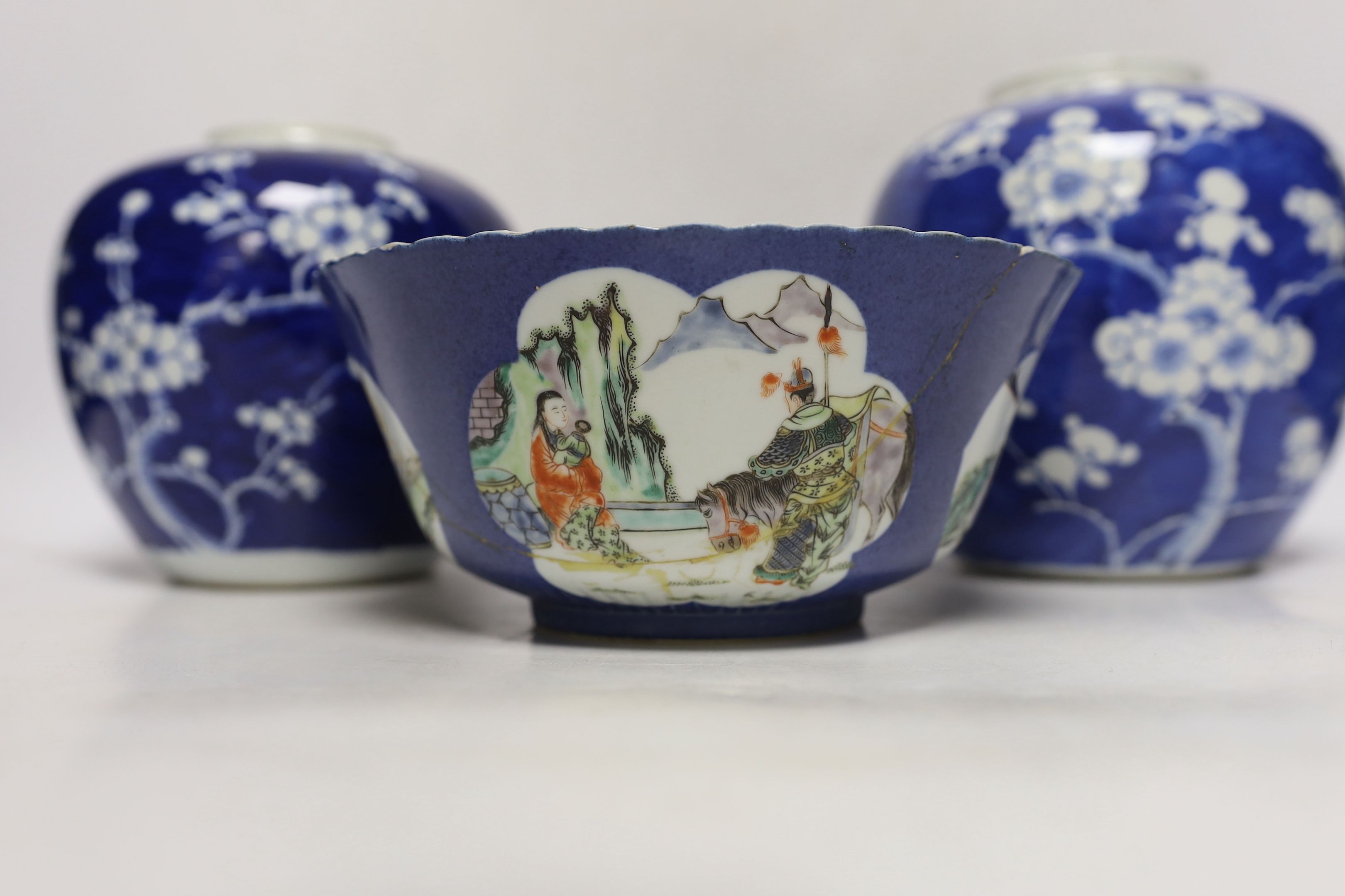 Two Chinese blue and white prunus jars, and a famille verte powder blue bowl, late 19th/early 20th century, tallest 17.5cm